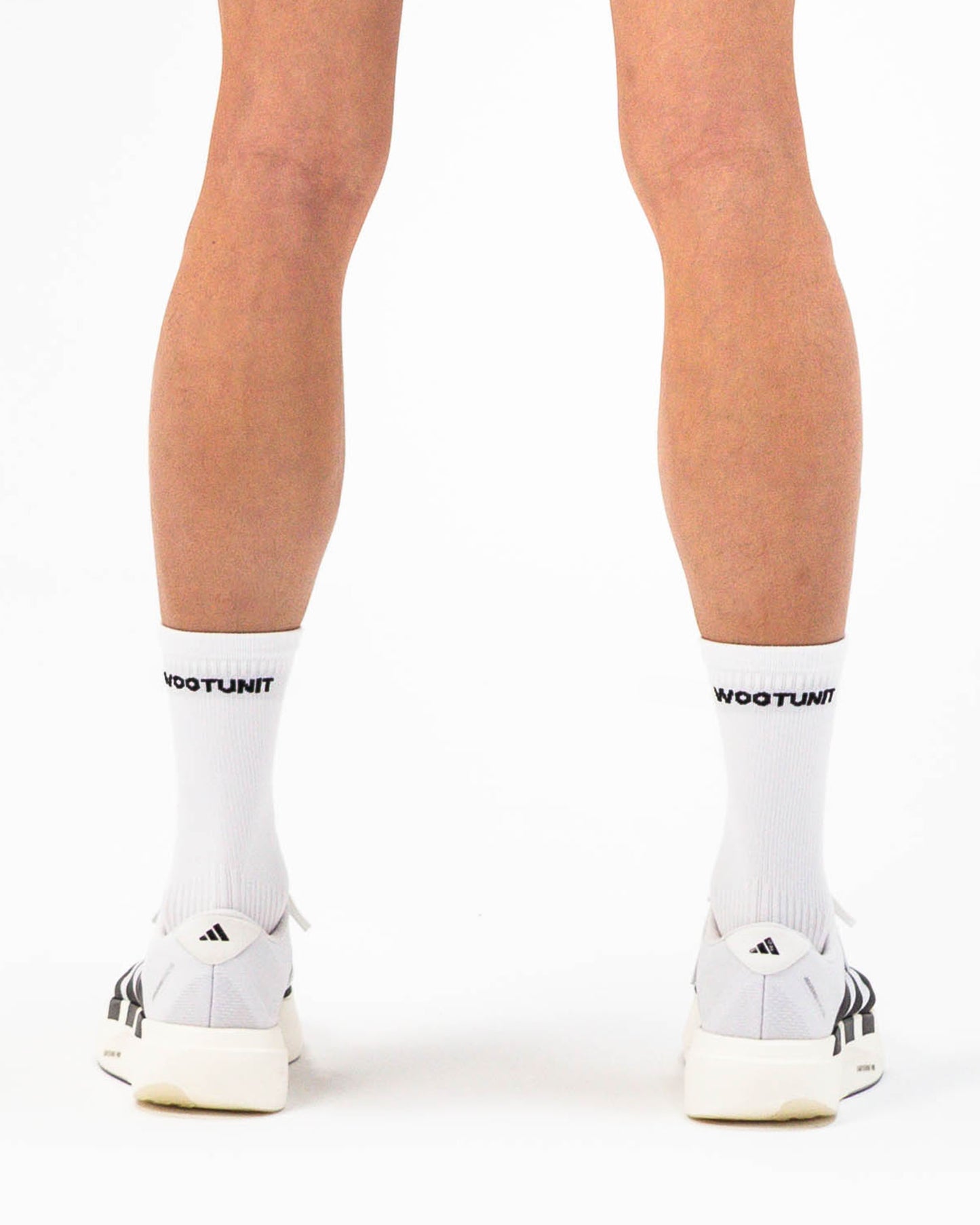 Calzini sportivi bianchi unisex WOOTUNIT altezza media per running Made in Italy vista posteriore